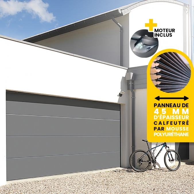 Garage avec parois en lame de pierre, porte sectionnelle, gris foncé